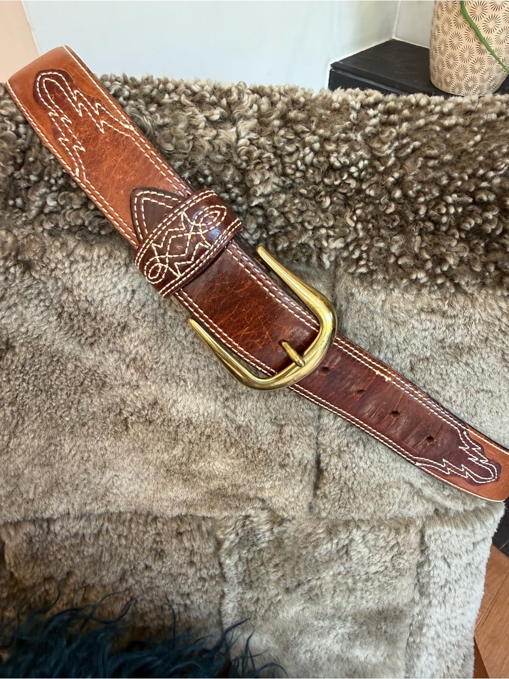 Brown leather western belt with contrast stitching and a brass buckle. Size 34